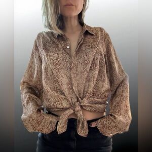 A shirt that features snake skin prints! 
Size L but can fit a size S or M